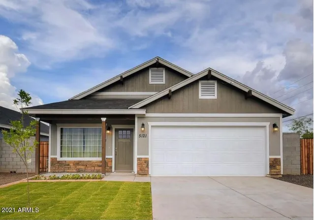 a front view of the house with a yard