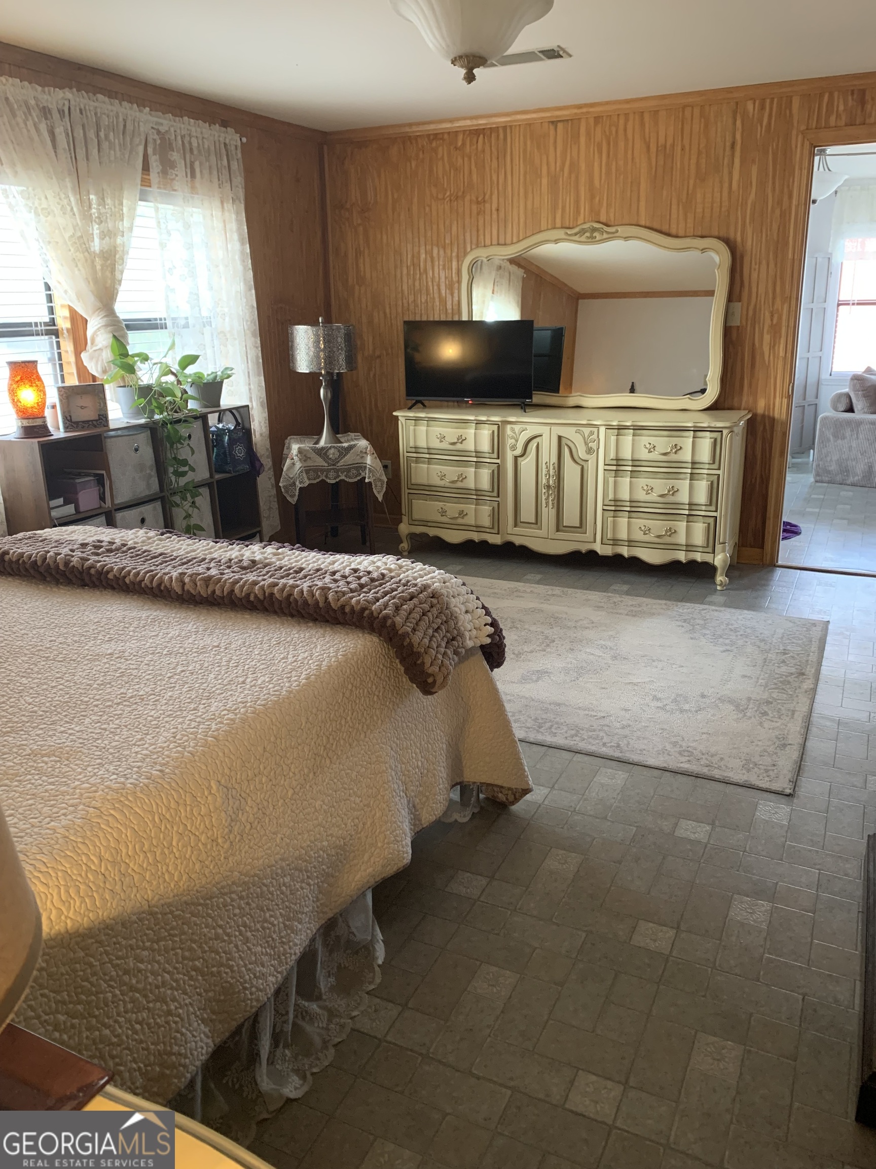 1066 Millen Hiltonia Road Sylvania, GA 30467 - Photo 12 of 24 a bedroom with a bed and window