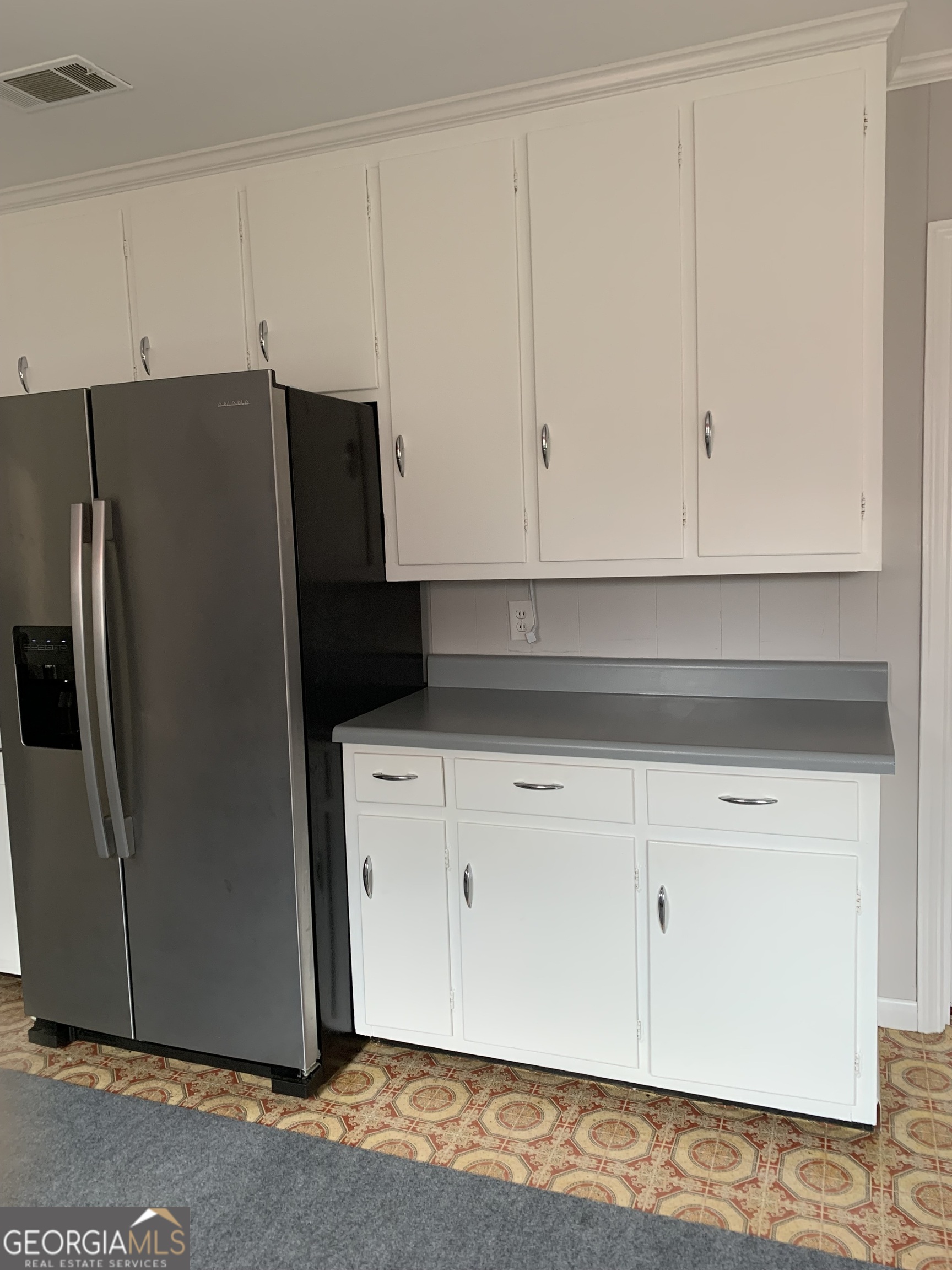 1066 Millen Hiltonia Road Sylvania, GA 30467 - Photo 4 of 24 a view of cabinets and refrigerator