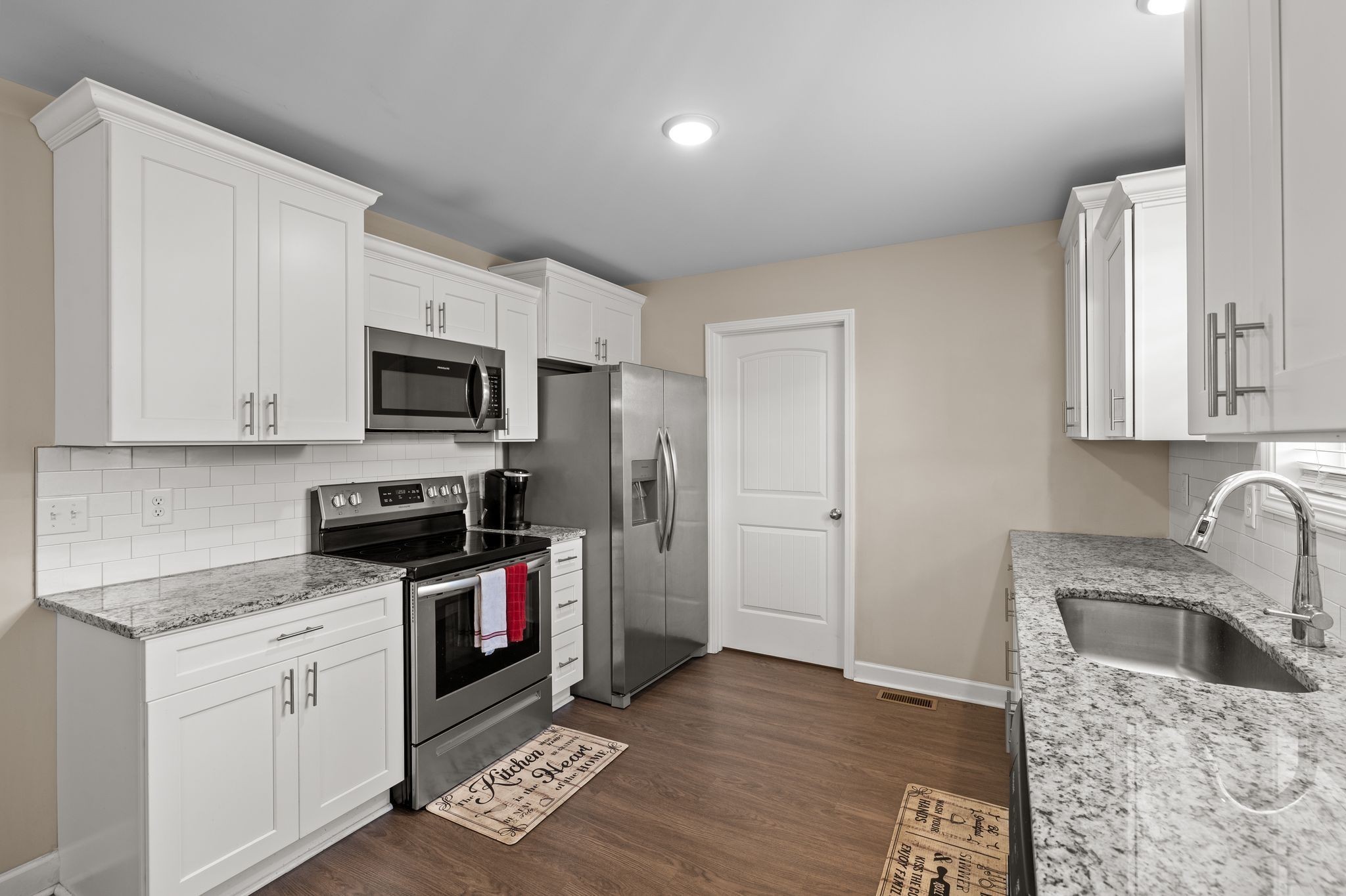 2511 Unionville Deason Road Bell Buckle, TN 37020 - Photo 6 of 20 a kitchen with stainless steel appliances granite countertop a sink a stove a refrigerator and cabinets