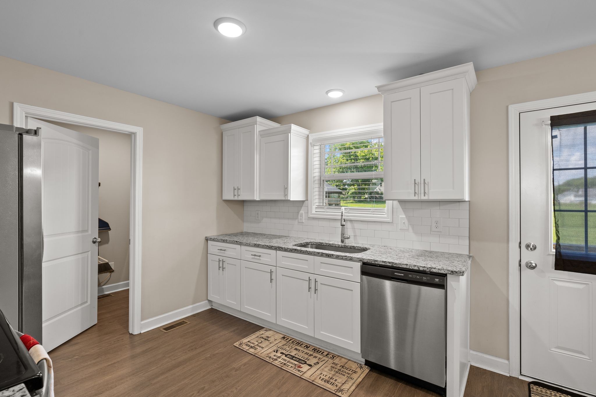 2511 Unionville Deason Road Bell Buckle, TN 37020 - Photo 7 of 20 a kitchen with stainless steel appliances granite countertop a sink and cabinets with wooden floor