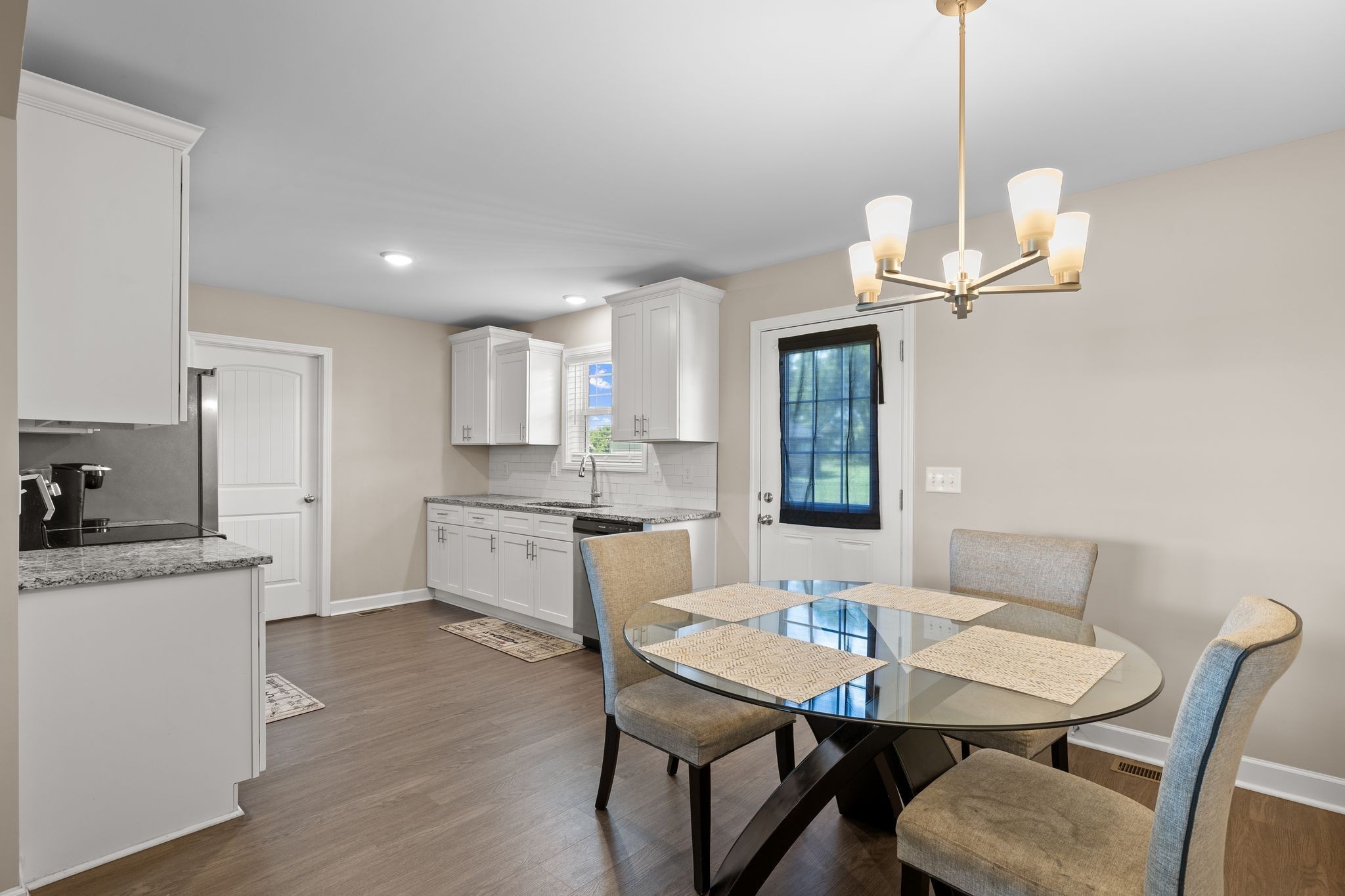 2511 Unionville Deason Road Bell Buckle, TN 37020 - Photo 8 of 20 a kitchen with stainless steel appliances kitchen island a table and chairs in it