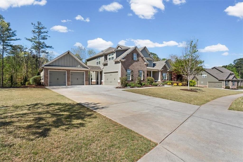 802 Double Branches Lane Dallas, GA 30132 - Photo 2 of 80 a view of multiple houses with a yard