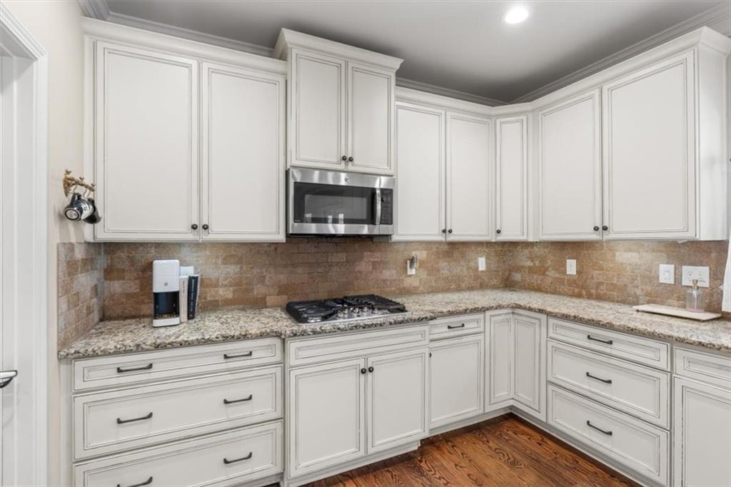 802 Double Branches Lane Dallas, GA 30132 - Photo 22 of 80 a kitchen with granite countertop white cabinets and stainless steel appliances
