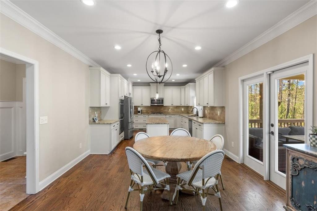 802 Double Branches Lane Dallas, GA 30132 - Photo 24 of 80 a view of a dining room with furniture window and wooden floor
