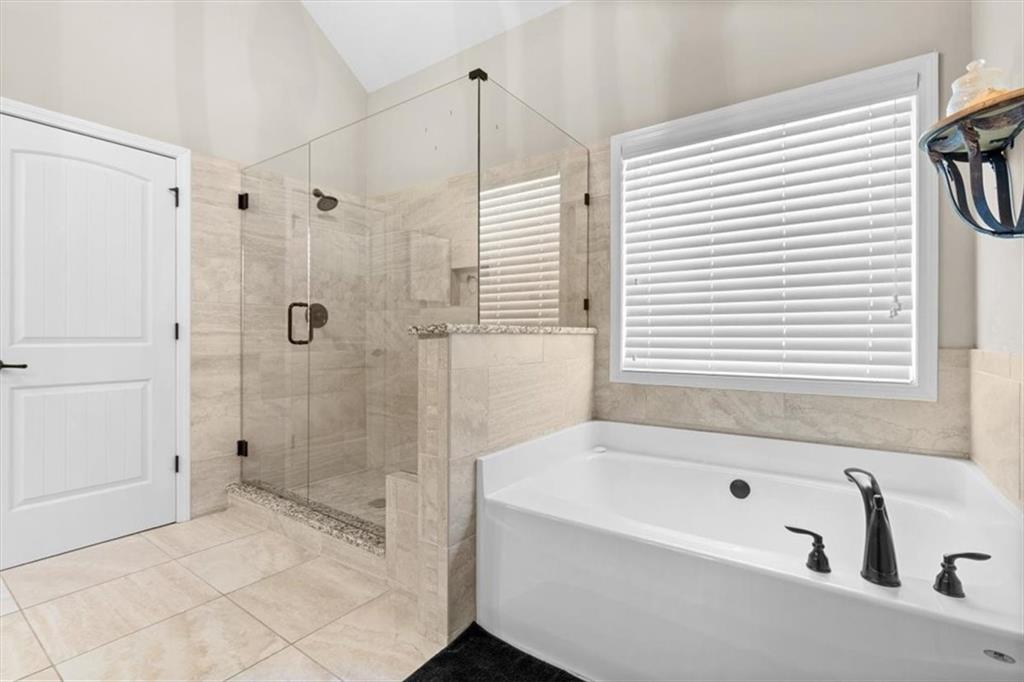 802 Double Branches Lane Dallas, GA 30132 - Photo 30 of 80 a bathroom with a bathtub and shower