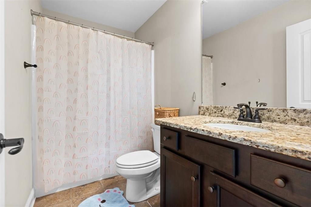 802 Double Branches Lane Dallas, GA 30132 - Photo 35 of 80 a bathroom with a granite countertop sink and a mirror