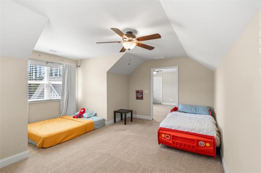 802 Double Branches Lane Dallas, GA 30132 - Photo 40 of 80 a bedroom with bed and a chandelier