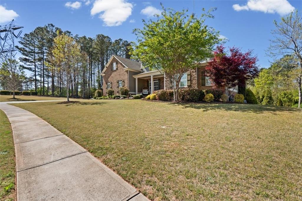 802 Double Branches Lane Dallas, GA 30132 - Photo 4 of 80 a front view of a house with a yard and trees