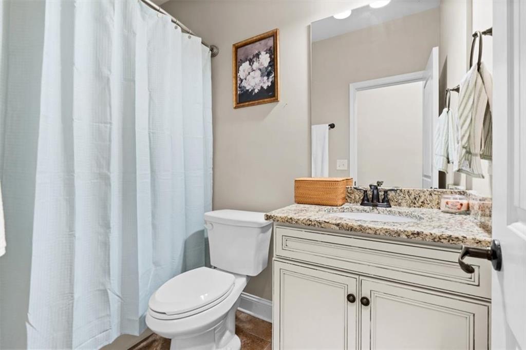 802 Double Branches Lane Dallas, GA 30132 - Photo 41 of 80 a bathroom with a granite countertop toilet sink and mirror