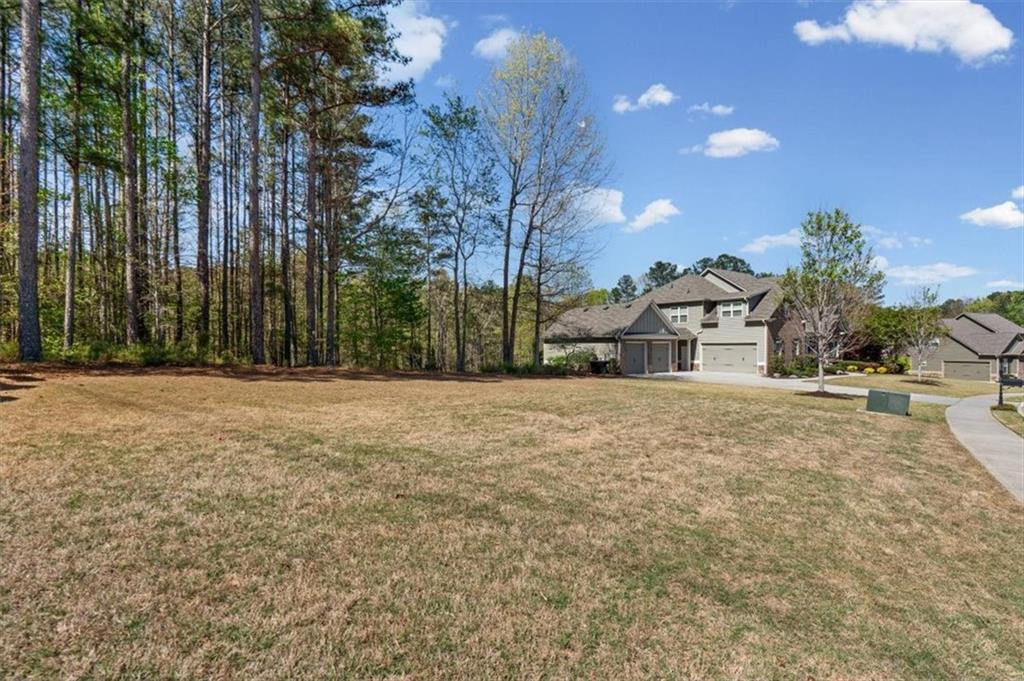 802 Double Branches Lane Dallas, GA 30132 - Photo 5 of 80 a yellow house with trees in front of it