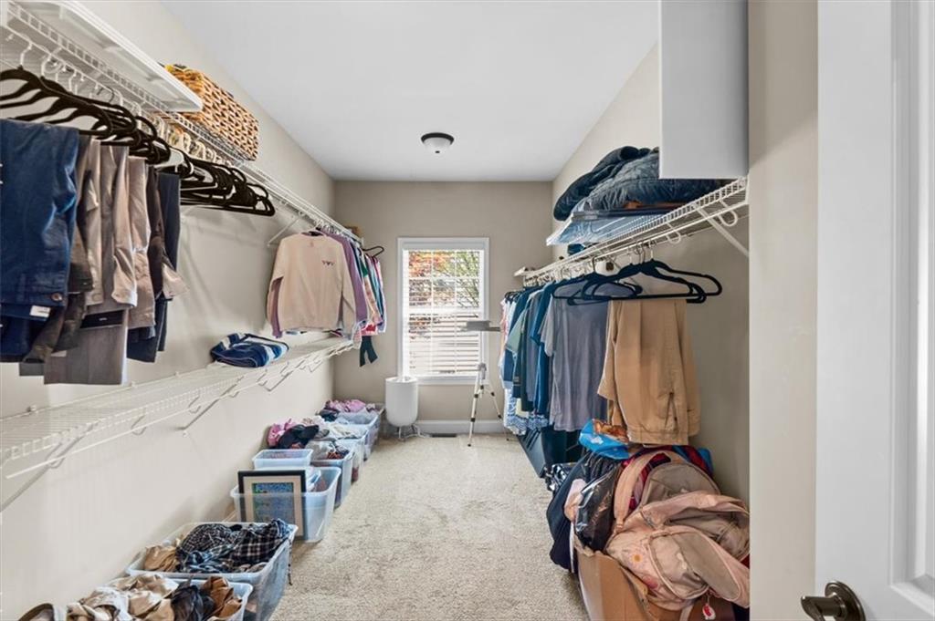 802 Double Branches Lane Dallas, GA 30132 - Photo 51 of 80 a view of walk in closet with clothes and shoes