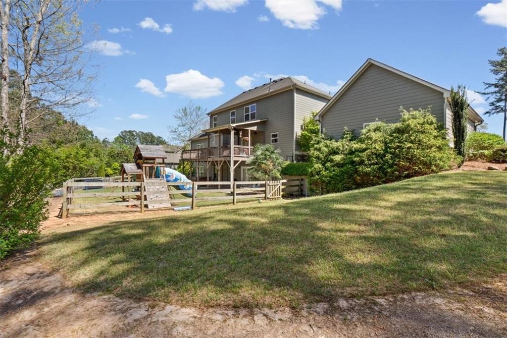802 Double Branches Lane Dallas, GA 30132 - Photo 65 of 80 a view of a house with backyard and sitting area