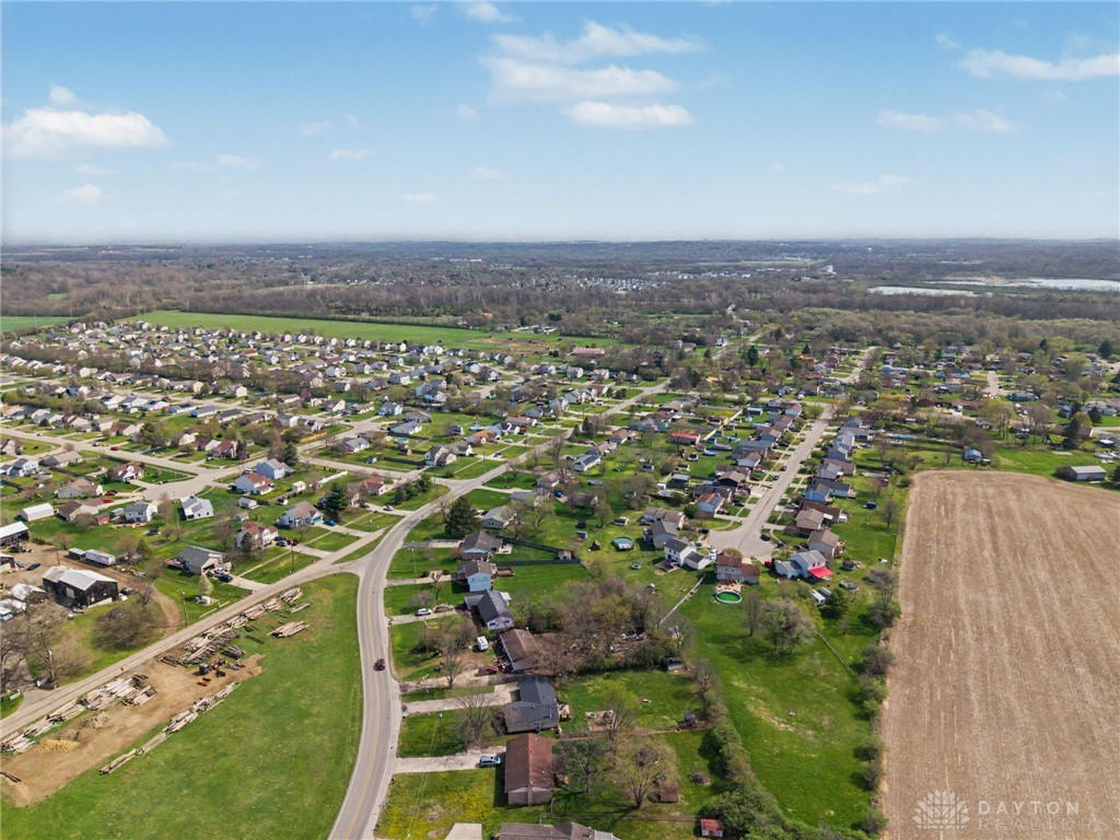 8969 Franklin-Trenton Road Franklin, OH 45005 - Photo 20 of 49 This elevated view captures a charming residential community nestled amongst lush green fields.