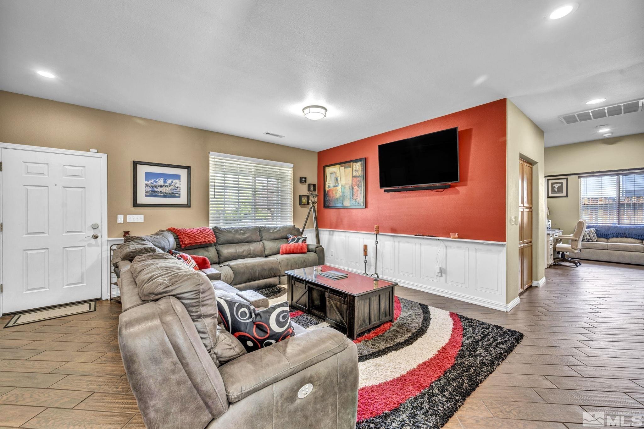 6015 Stillmeadow Drive Reno, NV 89502 - Photo 20 of 39 a living room with furniture and a flat screen tv
