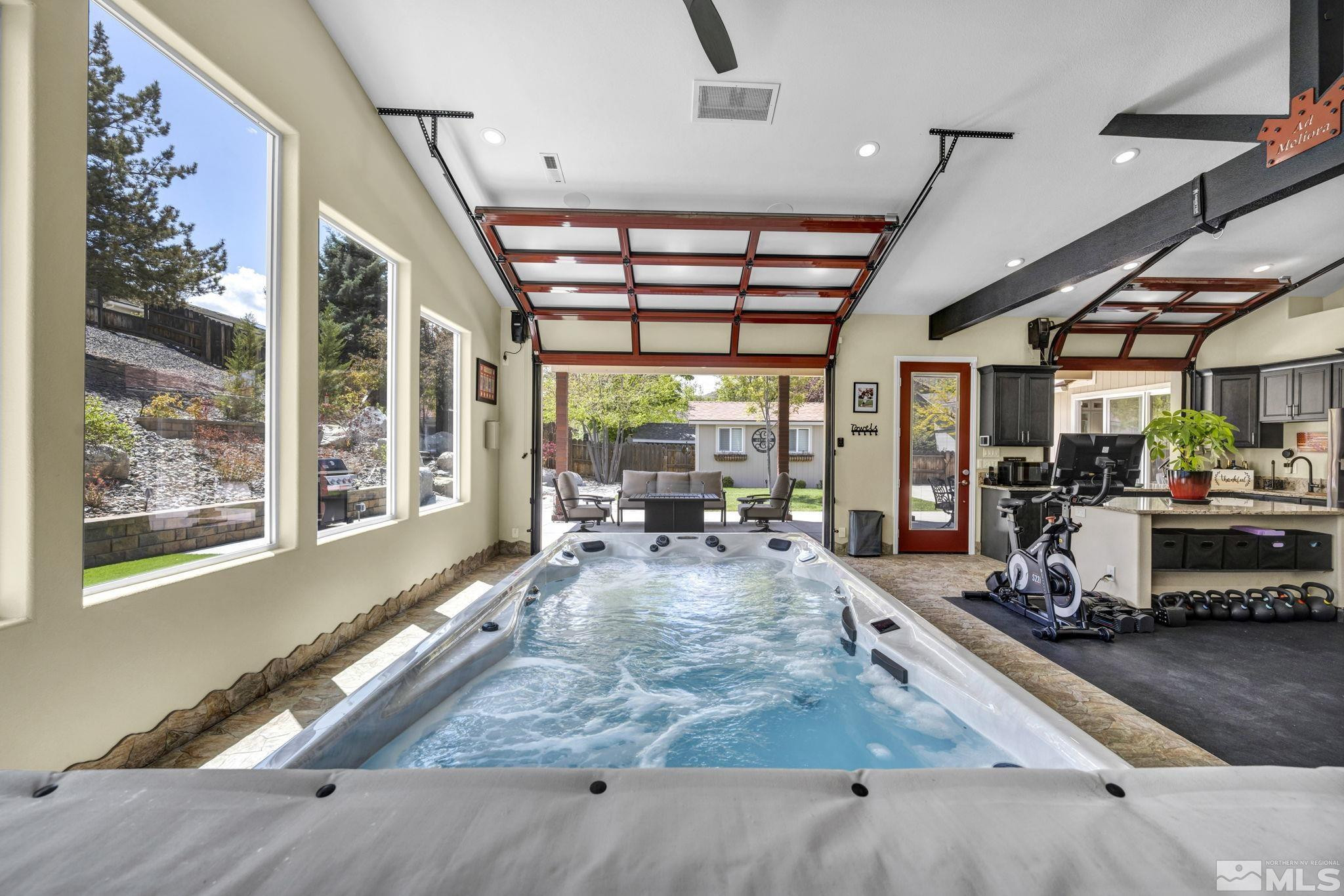6015 Stillmeadow Drive Reno, NV 89502 - Photo 2 of 39 a living room filled with lots of furniture hardwood floor and a large window