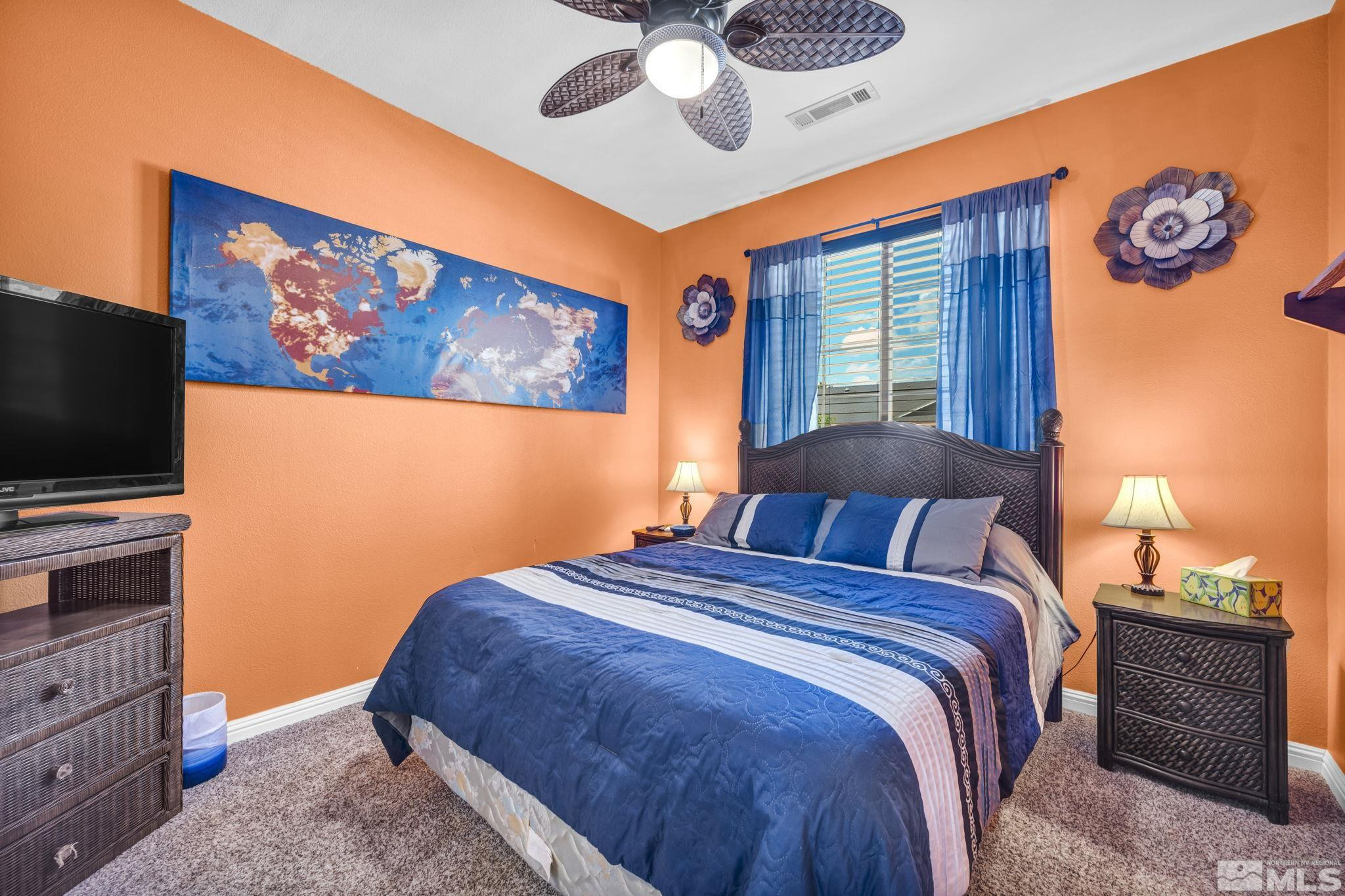 6015 Stillmeadow Drive Reno, NV 89502 - Photo 30 of 39 a bedroom with a bed and a flat screen tv