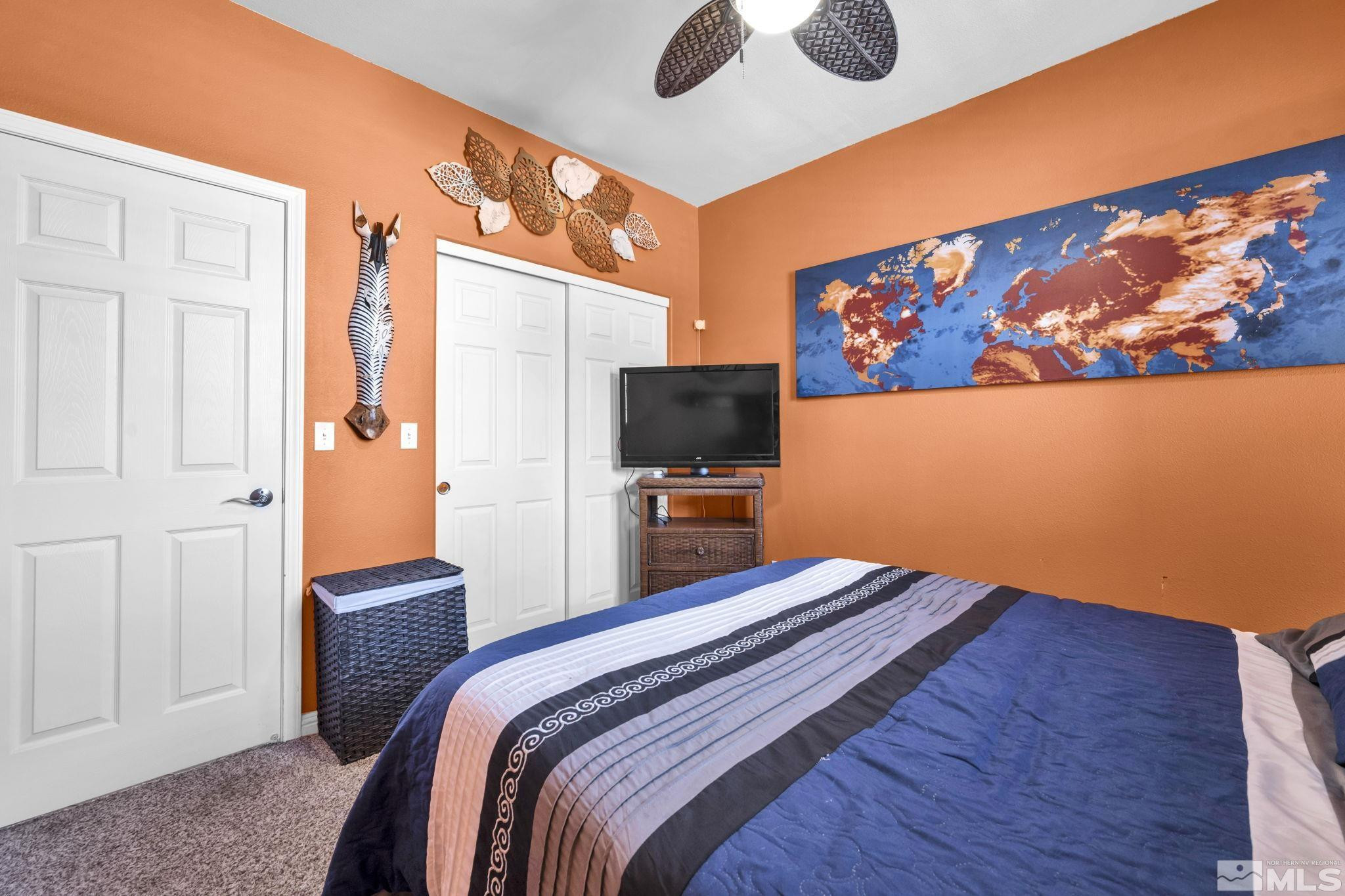 6015 Stillmeadow Drive Reno, NV 89502 - Photo 31 of 39 a bedroom with a bed and a flat screen tv