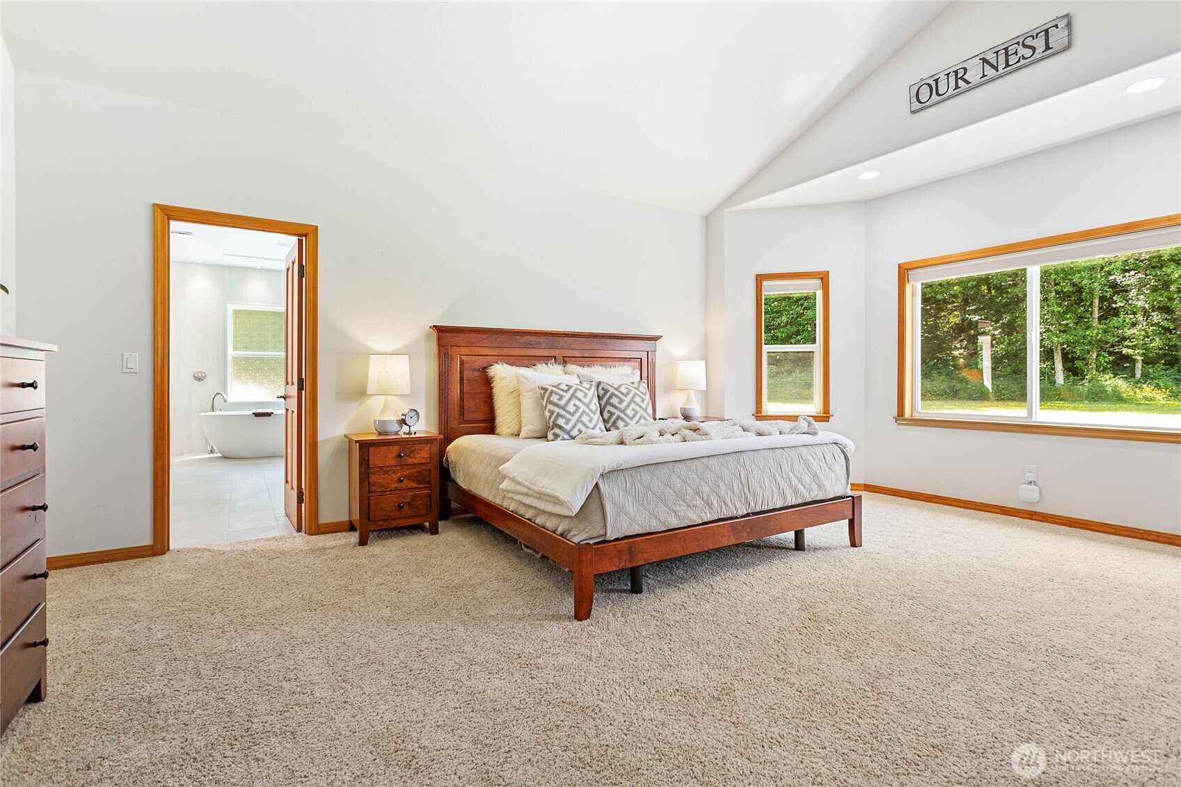 6068 East Hemmi Road Bellingham, WA 98226 - Photo 15 of 40 a bedroom with a bed and large windows