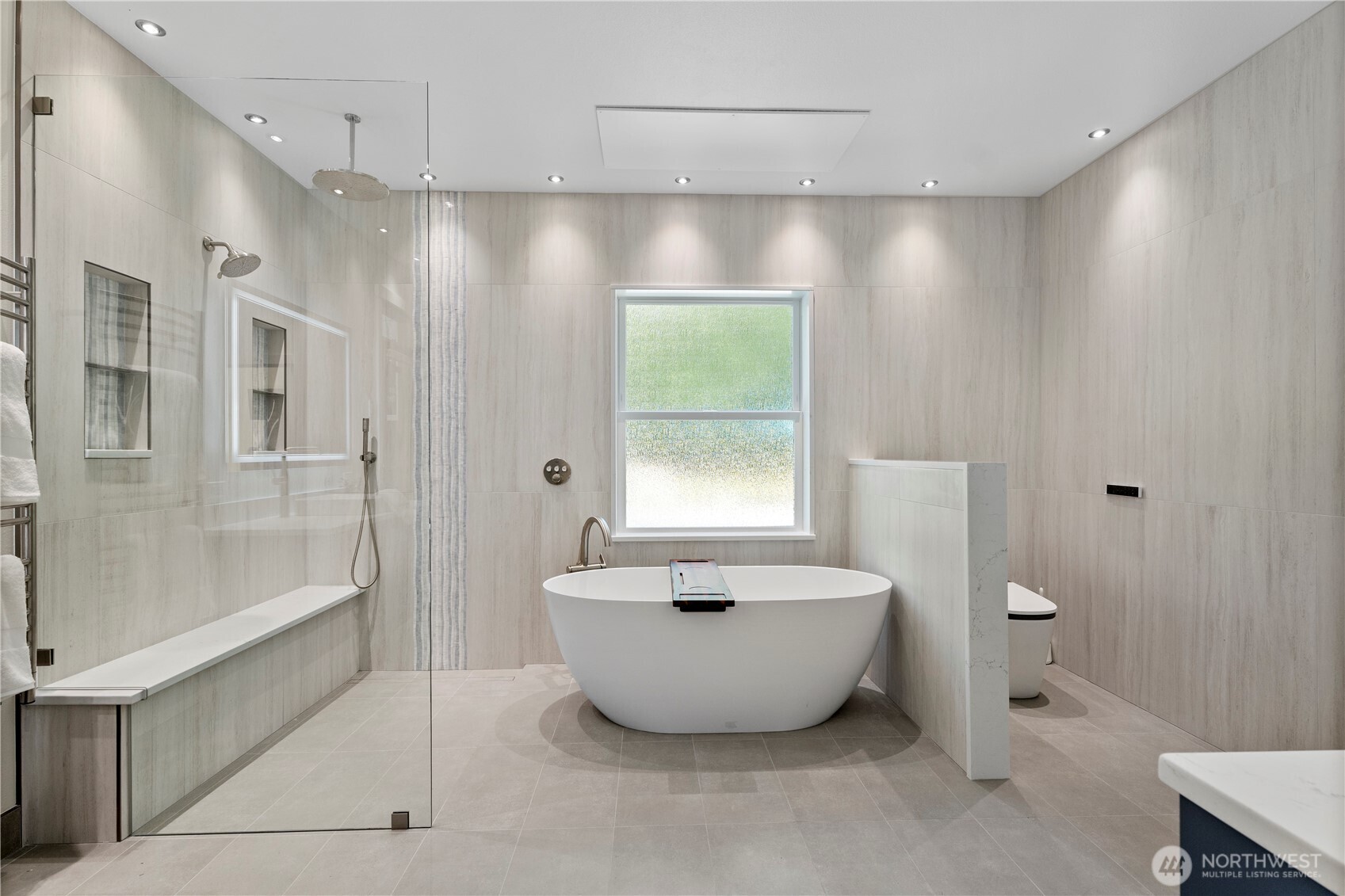 6068 East Hemmi Road Bellingham, WA 98226 - Photo 16 of 40 a spacious bathroom with a bathtub and shower