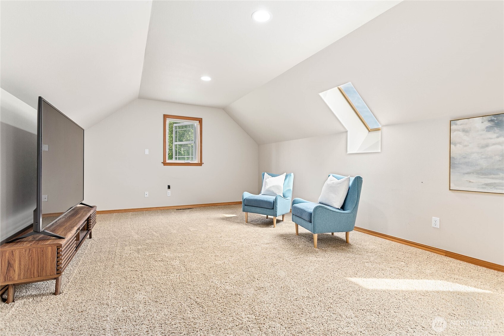 6068 East Hemmi Road Bellingham, WA 98226 - Photo 23 of 40 a living room with furniture and a flat screen tv