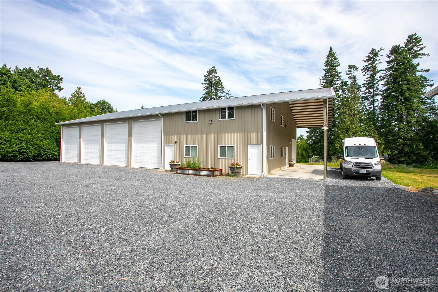 6068 East Hemmi Road Bellingham, WA 98226 - Photo 33 of 40 a view of a house with backyard and trees