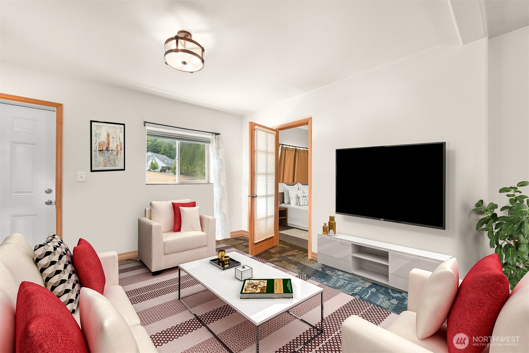 6068 East Hemmi Road Bellingham, WA 98226 - Photo 35 of 40 a living room with furniture a flat screen tv and a window