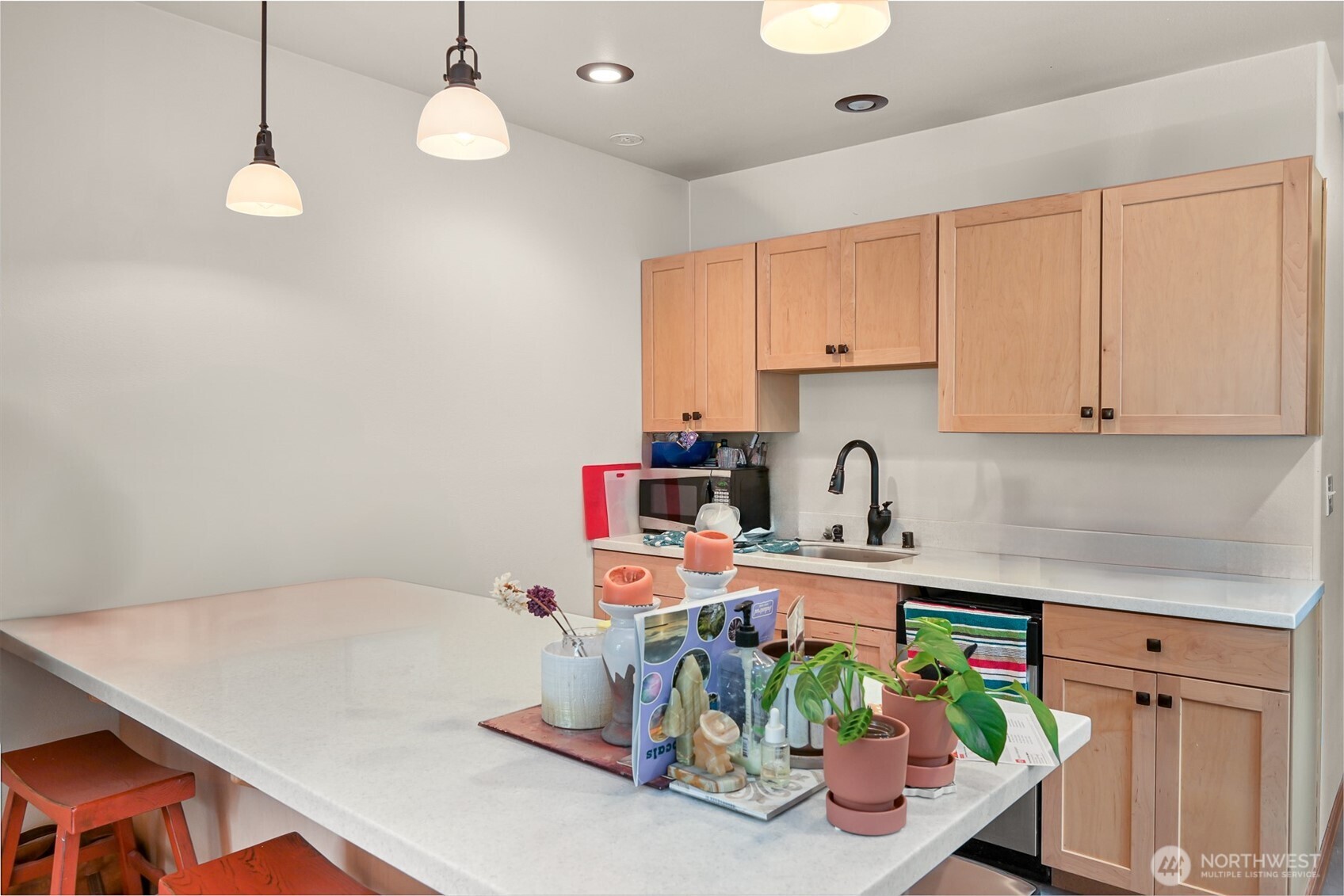 6068 East Hemmi Road Bellingham, WA 98226 - Photo 36 of 40 a kitchen with stainless steel appliances granite countertop a sink a stove and a white cabinets