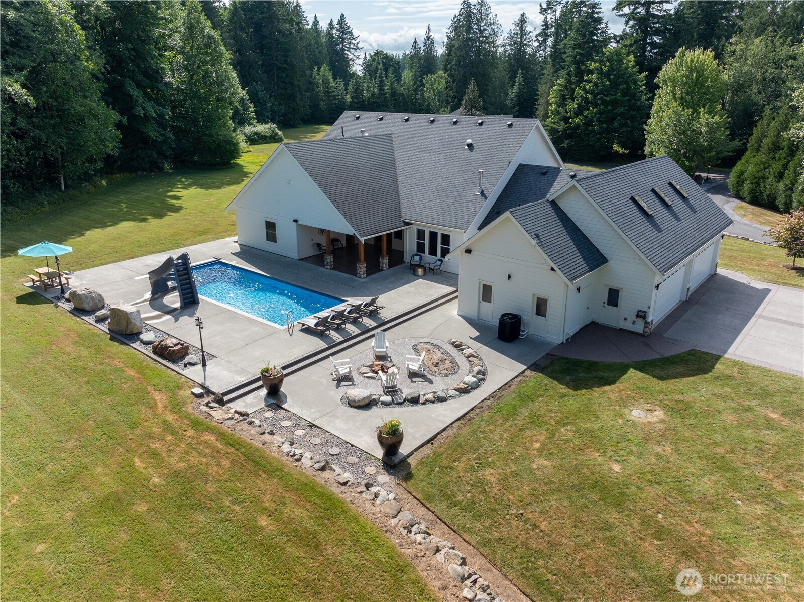 6068 East Hemmi Road Bellingham, WA 98226 - Photo 38 of 40 an aerial view of a house with swimming pool and lake view