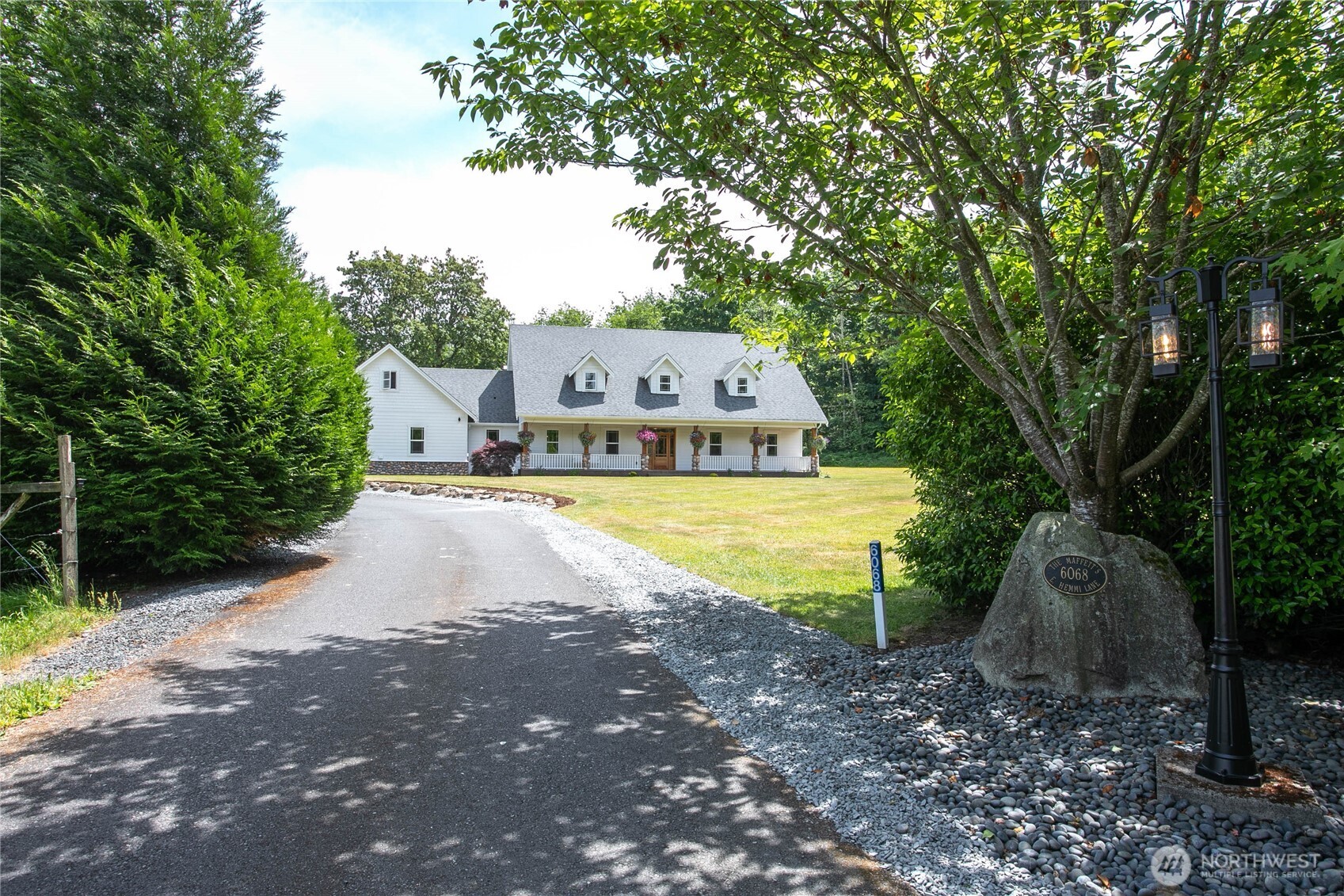 6068 East Hemmi Road Bellingham, WA 98226 - Photo 39 of 40 a view of a house with a yard