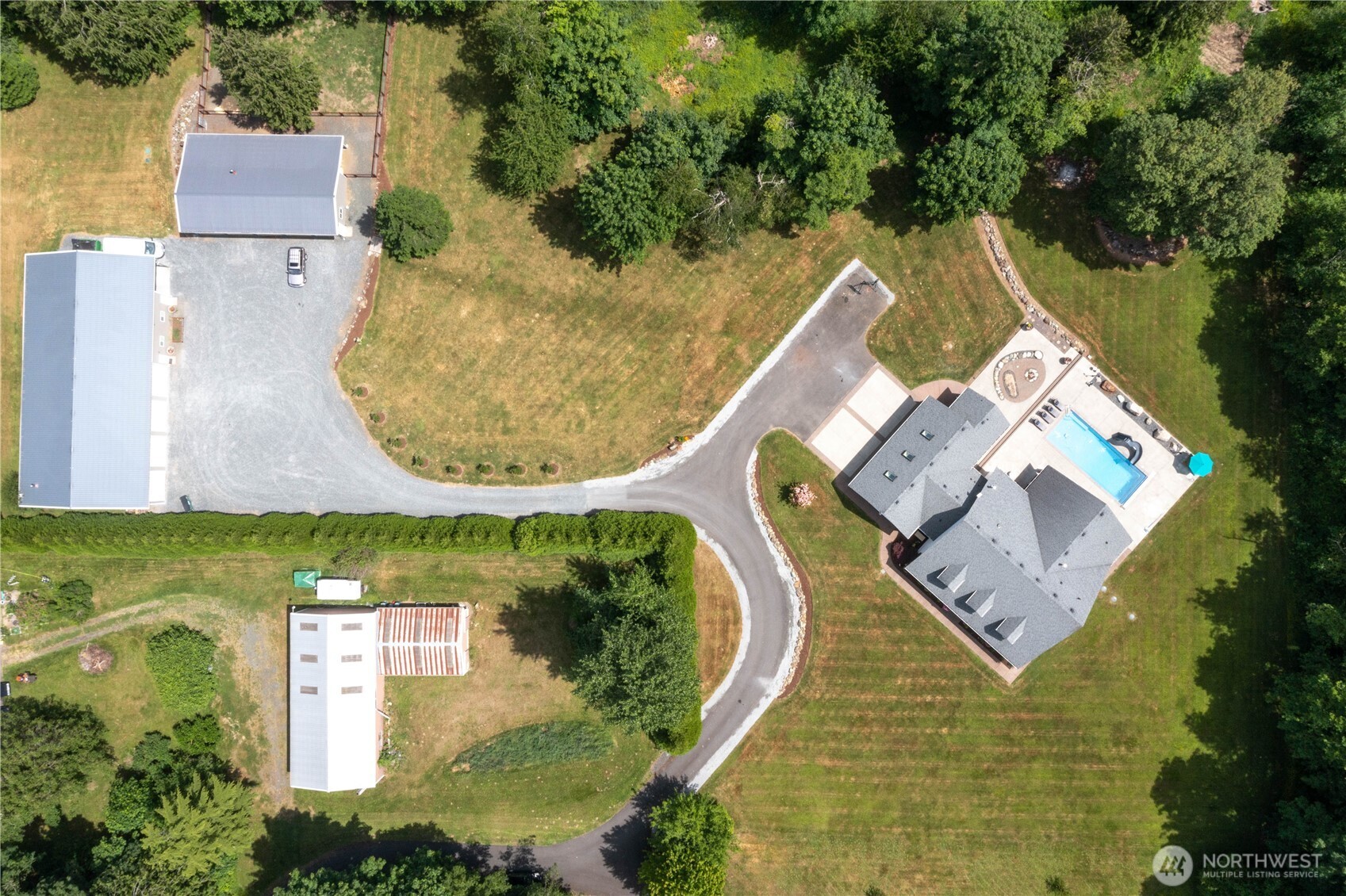 6068 East Hemmi Road Bellingham, WA 98226 - Photo 40 of 40 an aerial view of a house with outdoor space and swimming pool