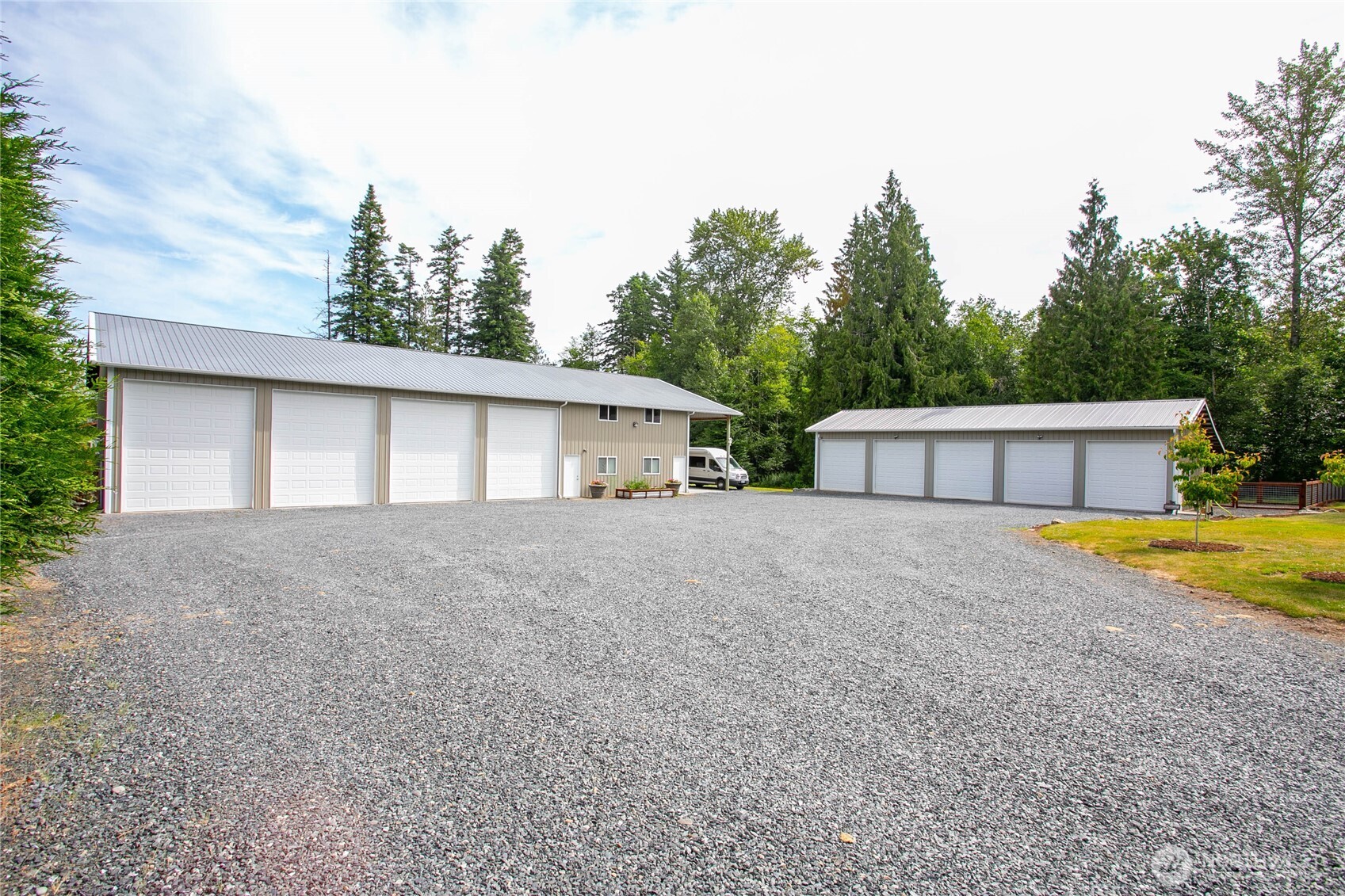 6068 East Hemmi Road Bellingham, WA 98226 - Photo 5 of 40 a front view of house with yard and trees in the background