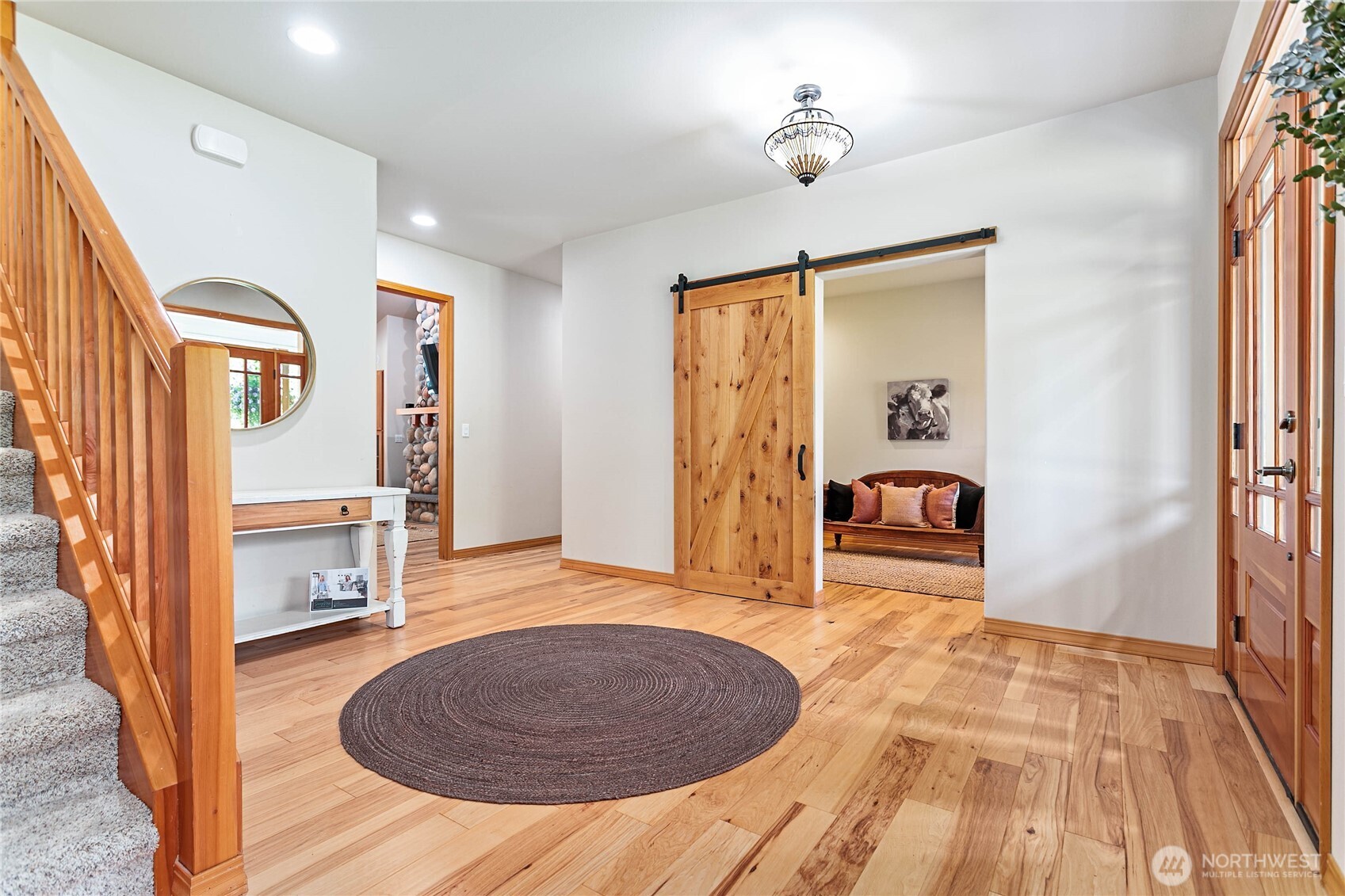 6068 East Hemmi Road Bellingham, WA 98226 - Photo 7 of 40 a view of livingroom with furniture window and wooden floor