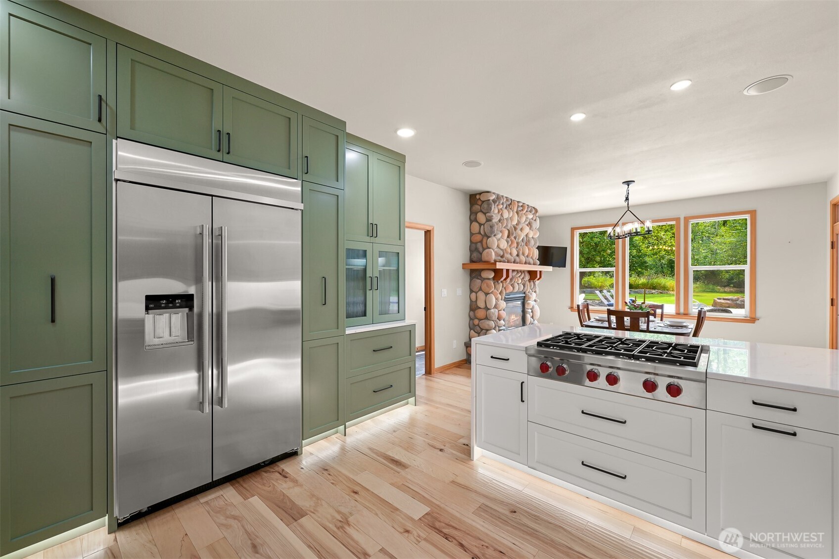 6068 East Hemmi Road Bellingham, WA 98226 - Photo 9 of 40 a kitchen with stainless steel appliances granite countertop a refrigerator and a stove