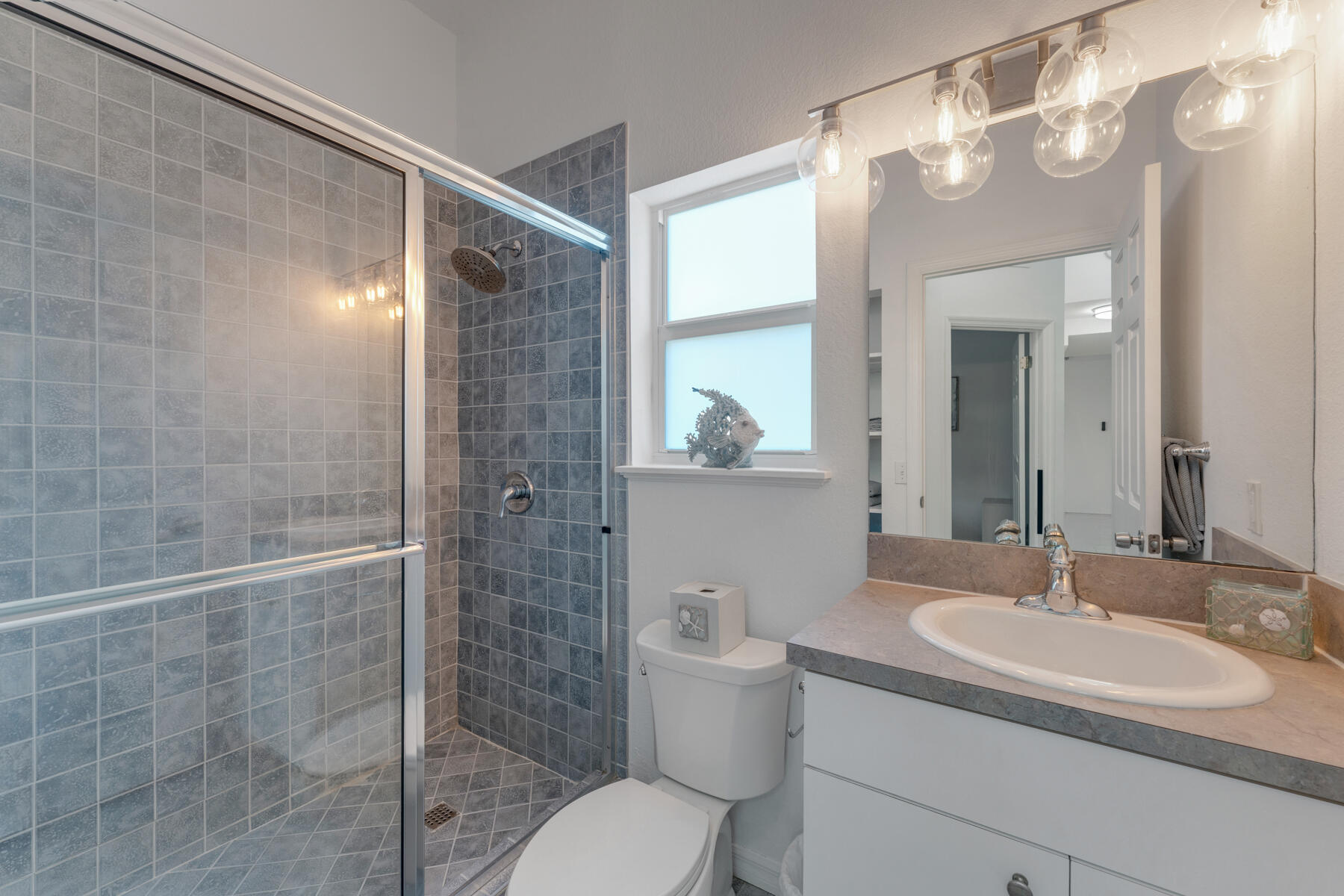 189 Carroll Street Islamorada, FL 33036 - Photo 25 of 37 a bathroom with a sink toilet and shower