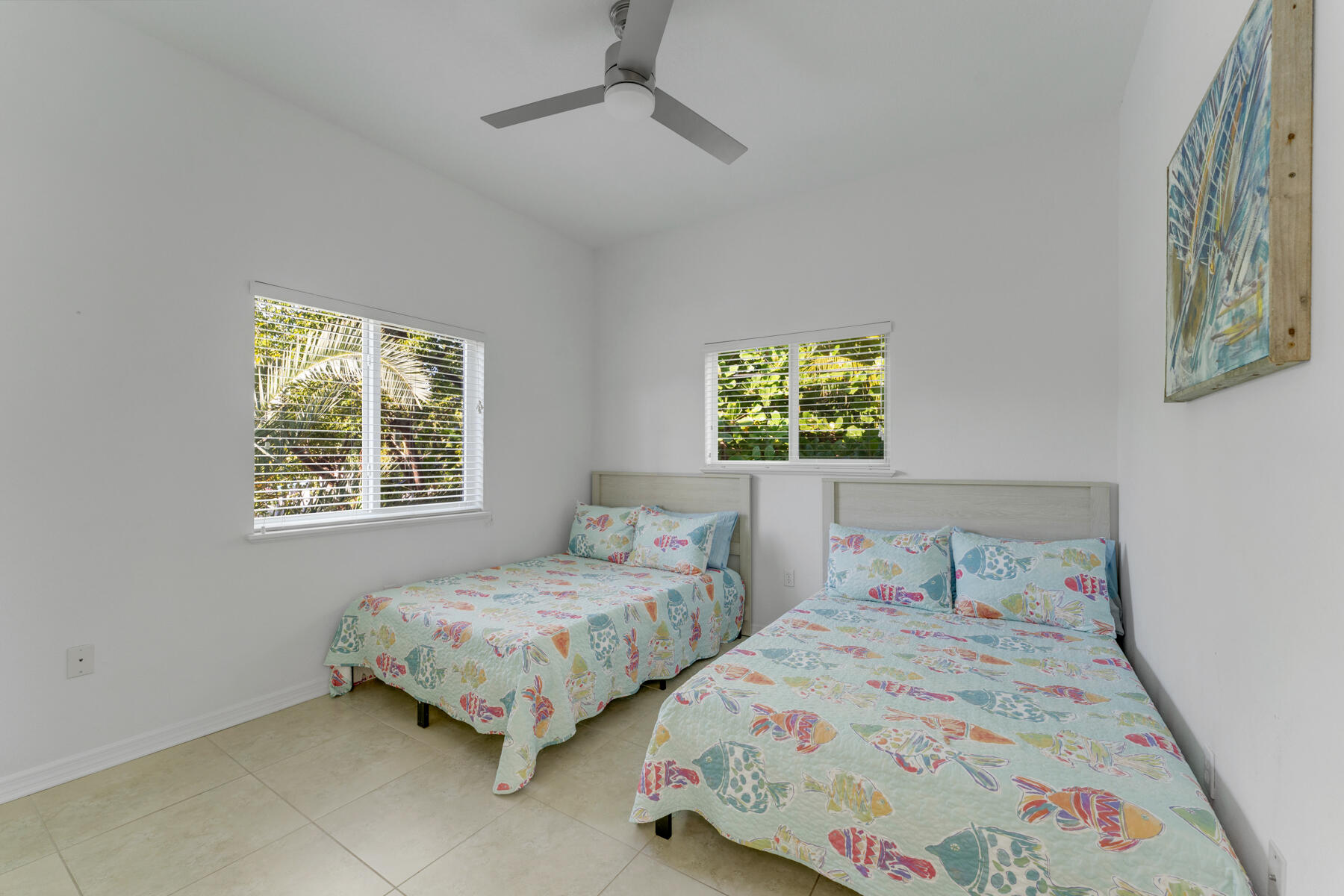 189 Carroll Street Islamorada, FL 33036 - Photo 26 of 37 a bedroom with two beds and painting on the wall