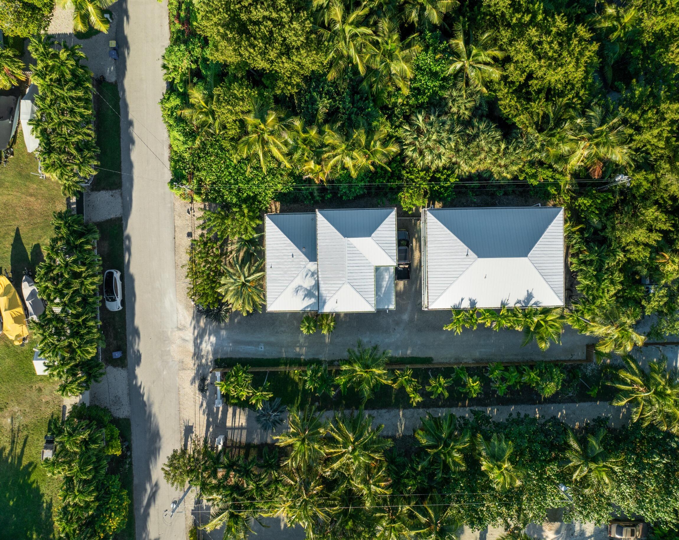 189 Carroll Street Islamorada, FL 33036 - Photo 28 of 37 an aerial view of a house with a yard