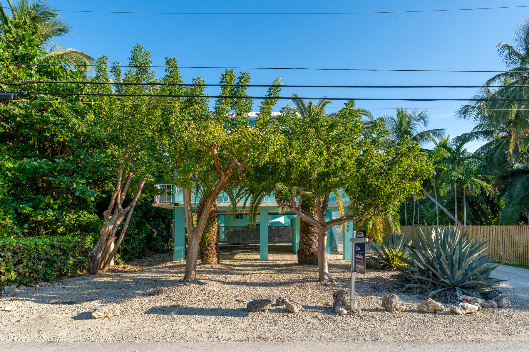 189 Carroll Street Islamorada, FL 33036 - Photo 4 of 37 a front view of a house with plants