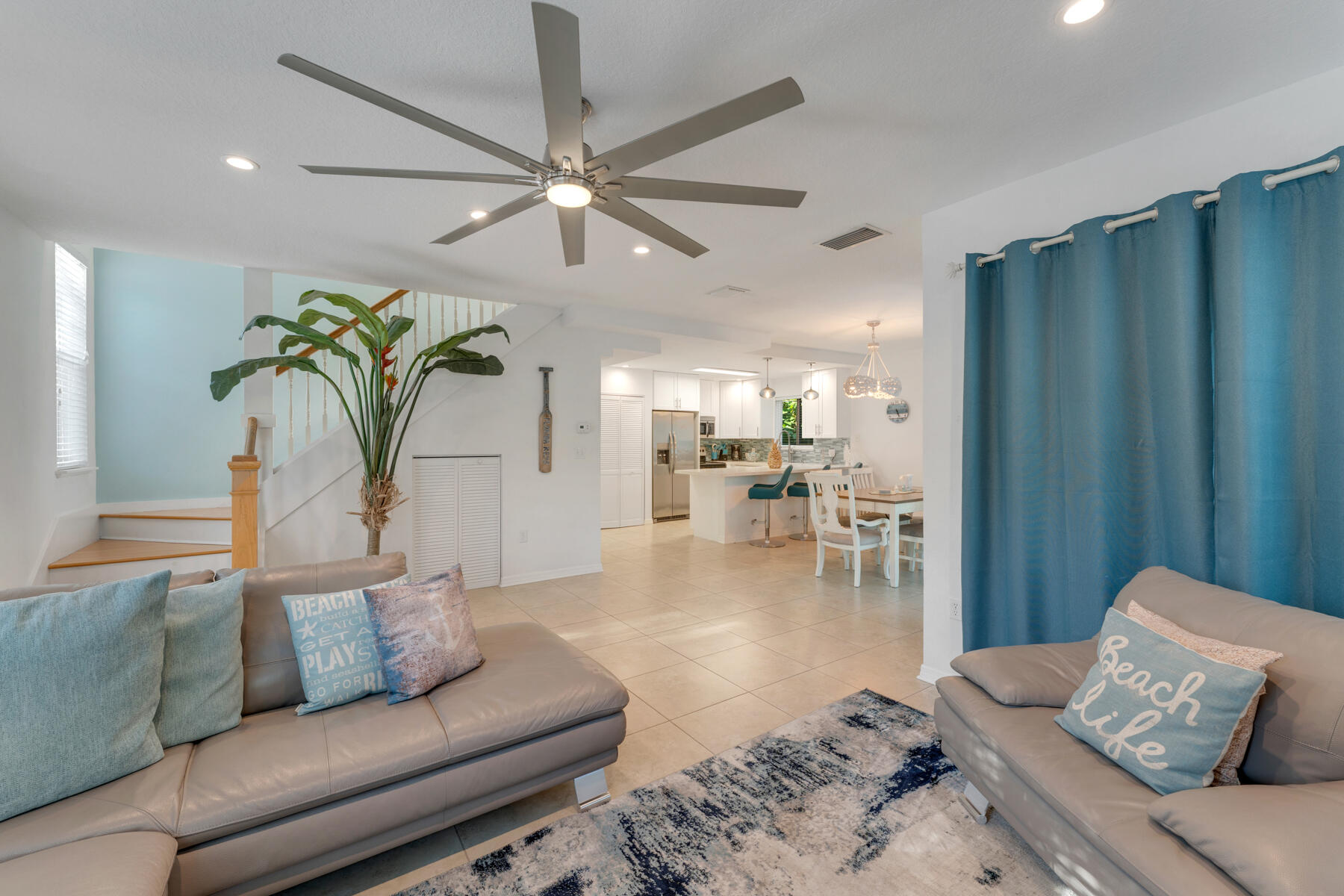 189 Carroll Street Islamorada, FL 33036 - Photo 9 of 37 a living room with furniture and a chandelier