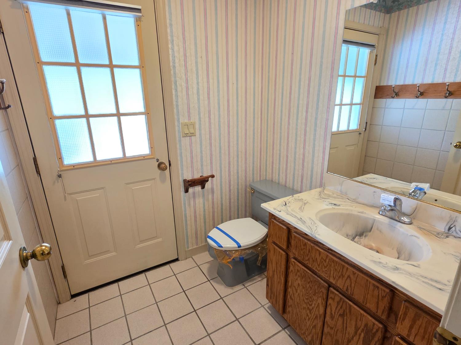 6416 Rio Blanco Drive Rancho Murieta, CA 95683 - Photo 17 of 70 Half bath and door to access the backyard pool and deck.