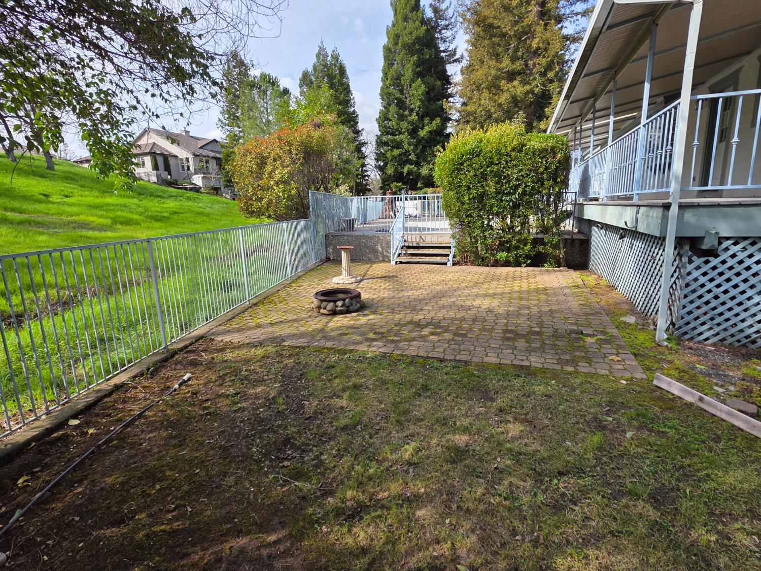6416 Rio Blanco Drive Rancho Murieta, CA 95683 - Photo 59 of 70 Note the steps from the stone fire pit area to the gated pool entry.