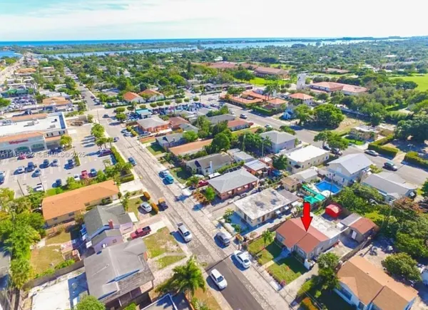 an aerial view of residential houses with outdoor space