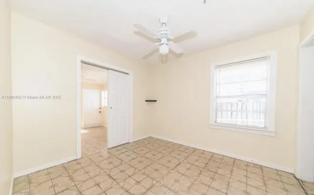 a view of an empty room and window