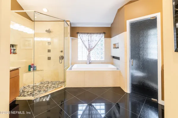 a bathroom with a toilet a sink and a window