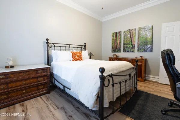 an aerial view of a house with a garden and swimming pool