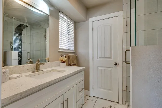 a bathroom with a sink and a mirror