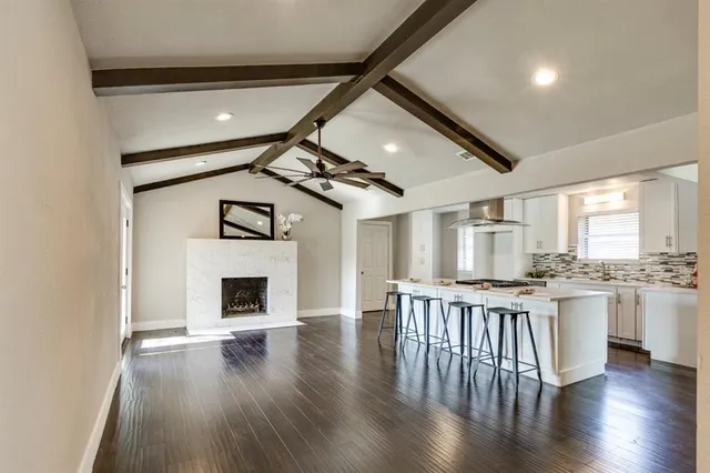 a open kitchen with sink stove and refrigerator