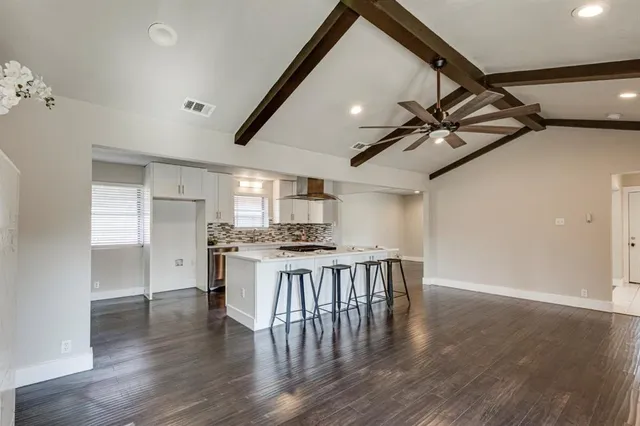 a kitchen with a table and chairs