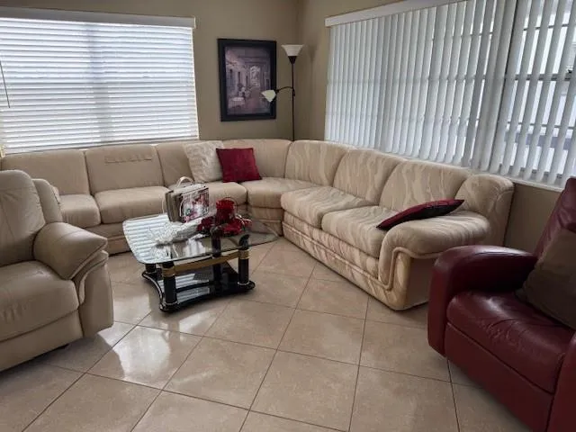 a living room with furniture and a window