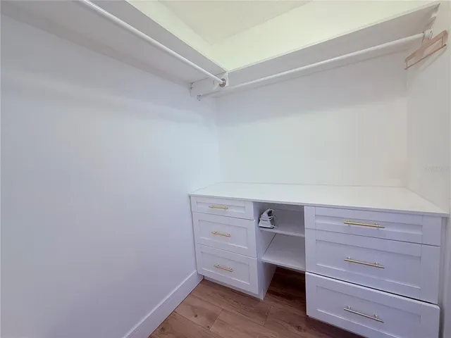 a bedroom with a bed and a table